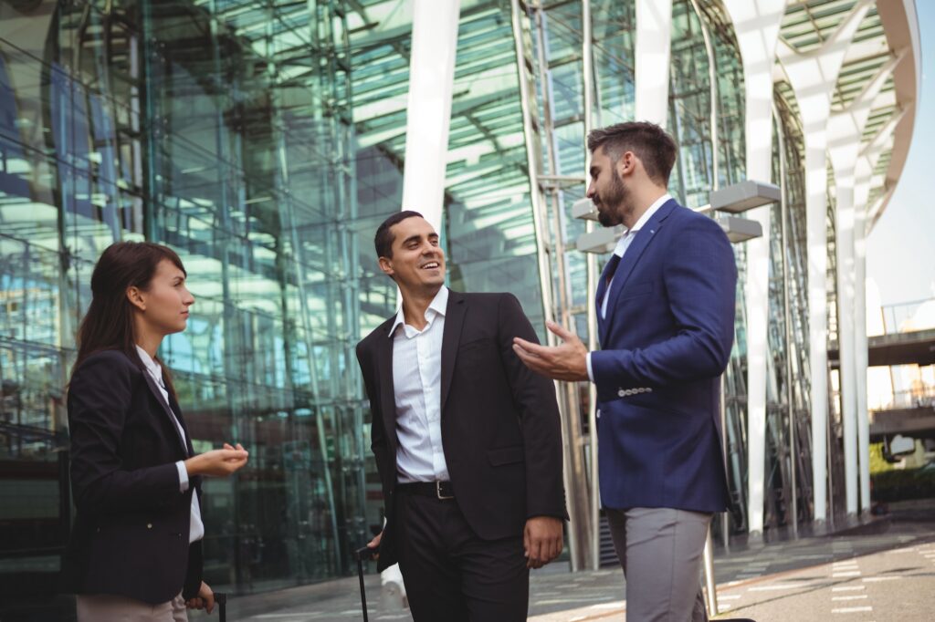 Businesses executives interacting with each other outside platform